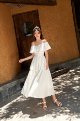 Off-Shoulder Pleated Midi Dress in Lightweight Silk with Fitted Waist and Button Detail